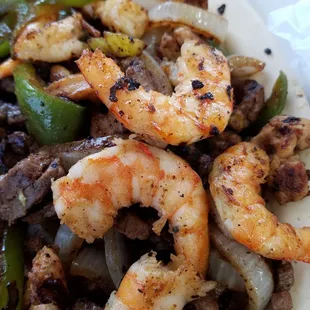 Shrimp, chicken and beef fajitas.  Sooo much food