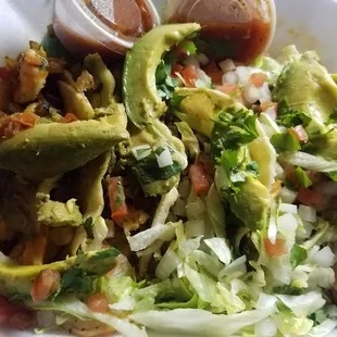 Shrimp and steak tacos with avacado n the fixins I promise there's tacos under there lol. These are the truth