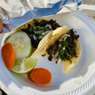 2 beef tacos. My first time eating here and I had to take a picture after taking a bite into it I had to take a picture.