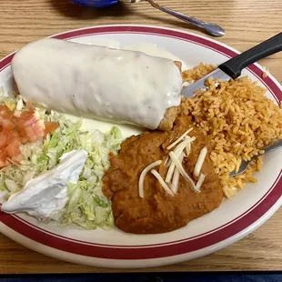 This is a chicken chimichanga with rice and beans.