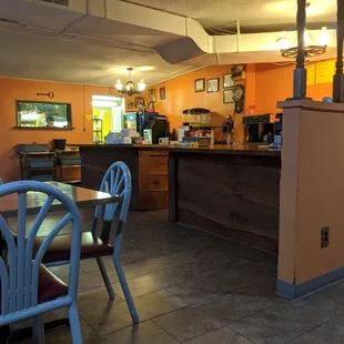 Counter, register and the pass from the kitchen.  Can you spot the Pope in the corner?