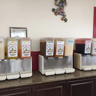 a row of drinks on a counter