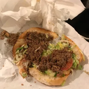 a sandwich with meat and lettuce