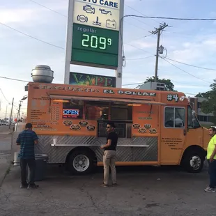 people ordering food from a food truck