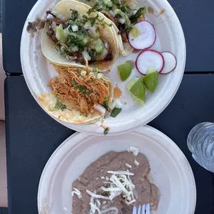 Chicken taco, taco al pastor, taco al alambre, side of beans