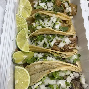 Tacos de lengua, carnitas, and chicharron