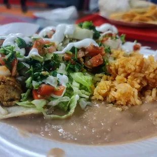 Chicken tacos with rice and beans