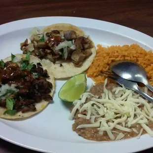 2 street tacos with rice and refried beans