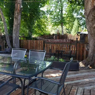 a patio with a table and chairs