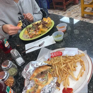 Torta plate with fries, Nacho supreme  with frijoles  Red and green salsa