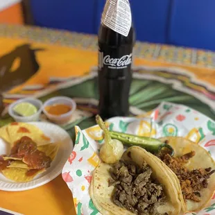 Carne Asada and Al Pastor tacos.