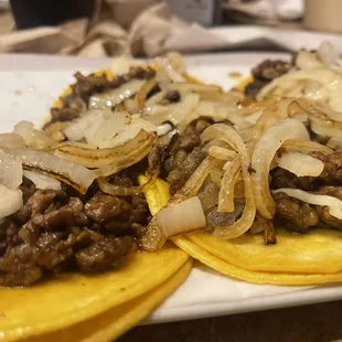 4 beef fajita tacos with grilled onions