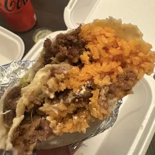 Really evenly filled burritos with rice, beans, meat. Carne asada burrito pictured. So yummy!