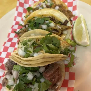Lengua, pollo, al pastor, and bistec tacos
