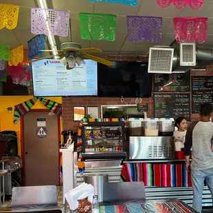 a man and a woman in a mexican restaurant