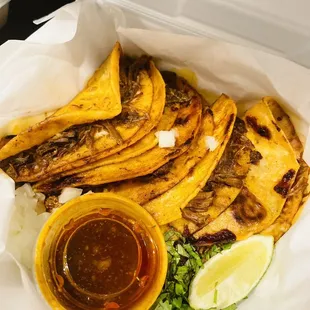 a taqueria of quesadillas in a styrofoam container