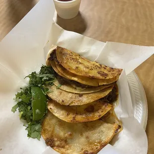 Tried the famous birria tacos! The order comes with 5 tacos and the dipping sauce