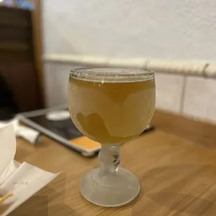 a glass of wine on a table