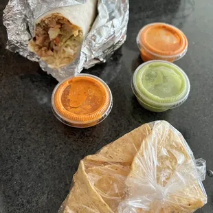 Super chicken burrito with chips and amazing sauce