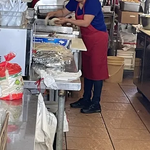 Cook not wearing a mask or food safety gloves