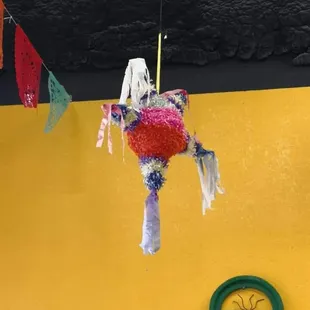 a colorful pinata hanging from the ceiling