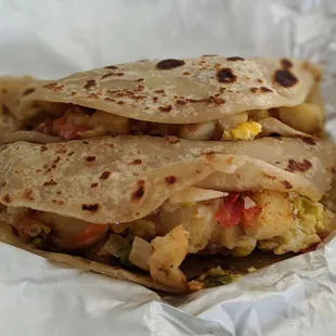 Flour breakfast taco: potatoes, egg, bean