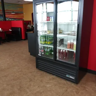Cooler with Jarritos, bottled drinks and desserts