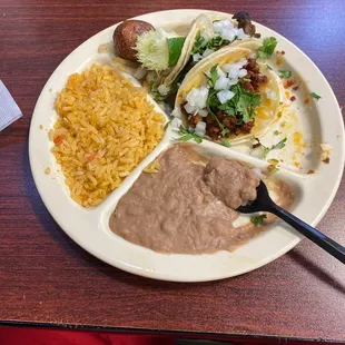 3 tacos with rice and beans holy shmokes the rice and beans are damn near as good as the tacos probably better