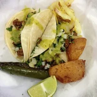 The plate comes with 4 tacos but I asked for 2 since they are so big