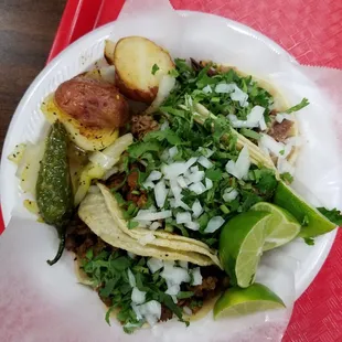 Lengua, carnitas, pastor, and asada tacos.