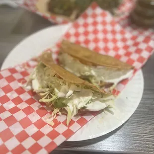 a plate of tacos on a table