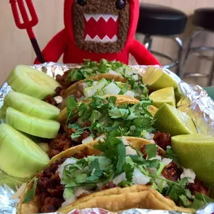 He likes to put the spicy salsa on his tacos.