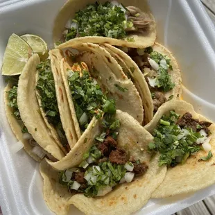 Assortment of pollo, carnitas, carne asada &amp; al pastor.