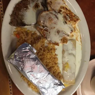 El Special. Steak, chicken, cheese enchilada, rice cheese sauce and tortillas.