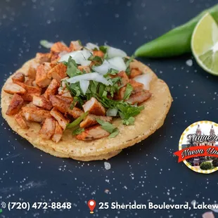 a tortilla topped with meat and vegetables