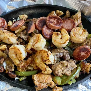 Sausage, shrimp, beef, chicken onions, peppers were so good.
