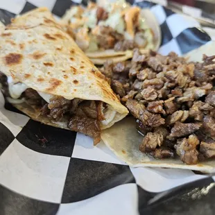 Carne asada taco and carne asada quesa taco