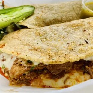 Quesabirirria
Quesadilla with fresh handmade tortillas filled with birria meat, mozzarella cheese, onion &amp; cilantro