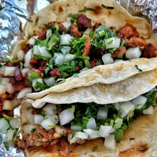 Tacos Al Pastor and Beef Fajita in flour tortilla.