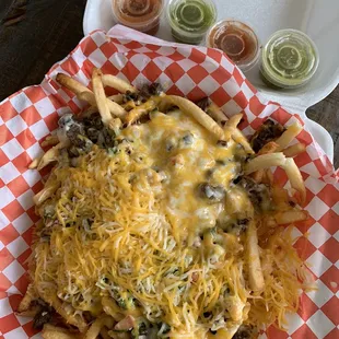 a plate of cheese fries