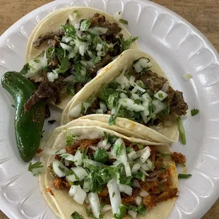 Tacos (two carne asada and one chicken). $1.50 each