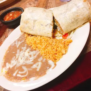 Huge steak burrito with side of rice and beans