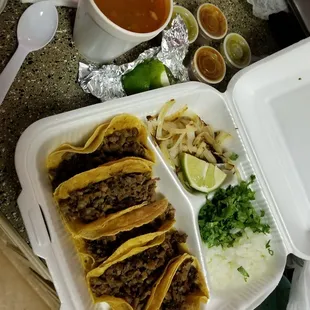 Asada mini tacos. Ordered the corn tortillas without oil and added grilled onions. Comes with limes and charro beans.