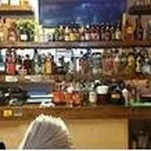 a woman sitting at a bar