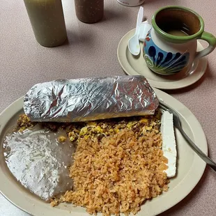 Chorizo and eggs with fresh tortillas, beans and rice.