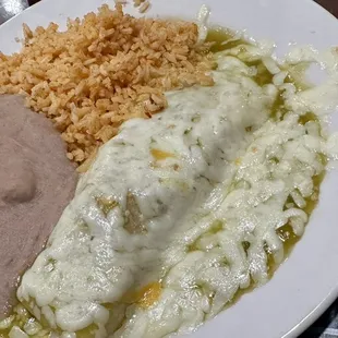 Chicken enchilada with green sauce and rice and beans