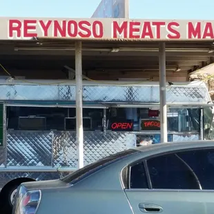Truck in front of market.