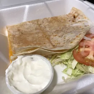 Cheese quesadilla comes with sour cream, bomb.