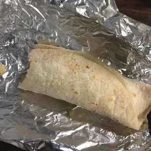 a burrito wrapped in tin foil