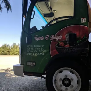a taqueria truck parked on the side of the road